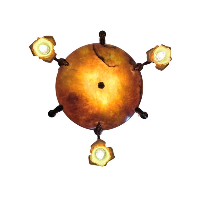 Elegant and large original alabaster chandelier featuring a richly detailed and beautifully cast bronze frame with ornate...