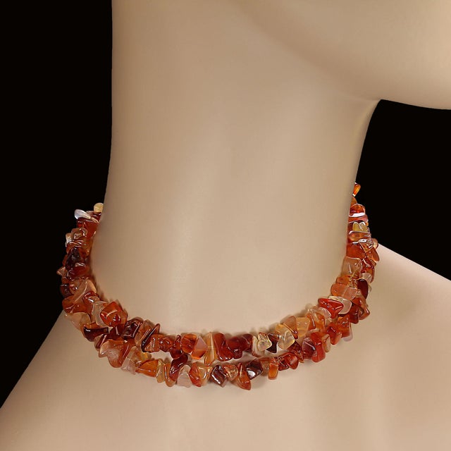This elegant 28‑inch Golden/Brown Agate chip necklace brings together natural beauty and refined craftsmanship in a piece...
