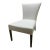 This is the Sevilla Chair Attributed to Brueton. It is upholstered in a cream fabric with dark maple legs.