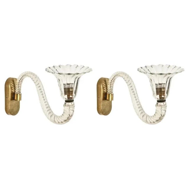 Magnificent pair of large bellflower-shaped sconces in Murano mouth-blown crystal glass and solid brass. These exceptional...