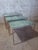 An elegant set of three French nesting tables dating from the 1970s, crafted in the style of the prestigious Maison...