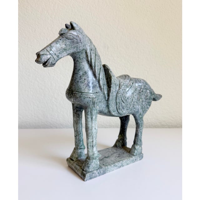 A hand-carved Chinese Tang Dynasty-style horse sculpture, modeled after the muscular, robust horses celebrated in art...