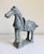 A hand-carved Chinese Tang Dynasty-style horse sculpture, modeled after the muscular, robust horses celebrated in art...