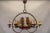 A rare french chandelier from the 1970s, featuring a hand-crafted wooden ship surrounded by six wrought iron candle...