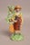 Antique early 19th century Georgian Staffordshire figure of a lady archer holding her bow and leaning on a tree bocage and...
