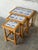 This set of three nesting tables features a traditional silhouette with intricately turned legs. The tiered design...