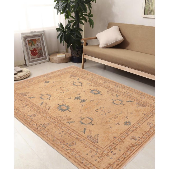 "Enhance the ambiance of your home with this magnificent Persian-influenced Turkish hand-knotted rug made by skilled...