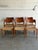 This set of 6 dining chairs features sculptural open backrests paired with tightly woven cord seating. The organic curves...