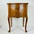 This is a lovely 1970s French Provincial Side Table or Nightstand with hand carved wood accents. The piece is walnut wood...
