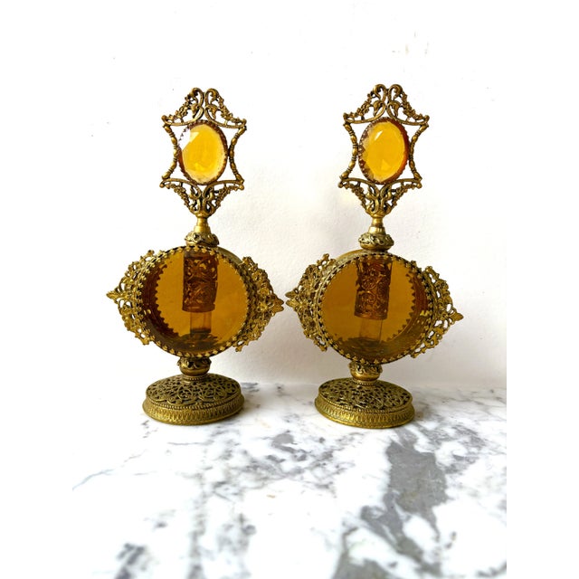 Lovely set of Hollywood, Regency glass and brass perfume bottles.