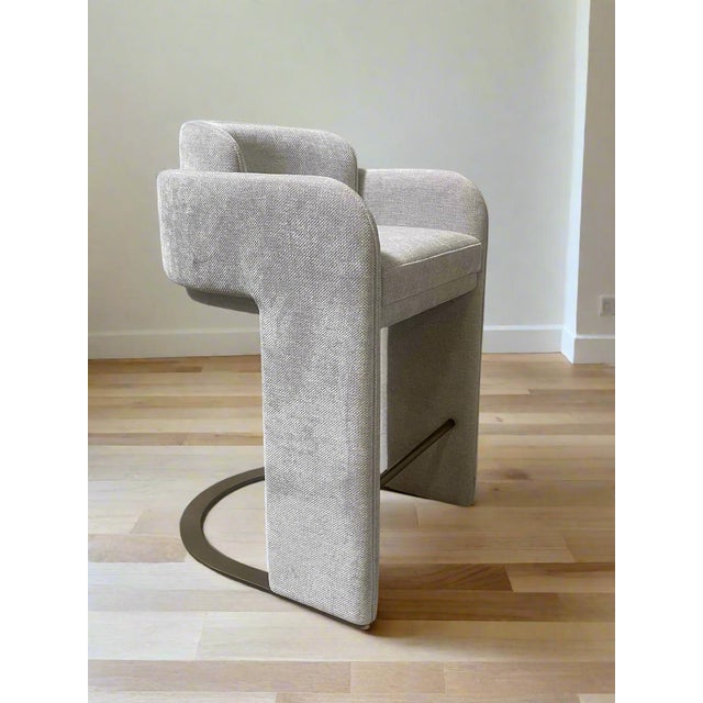 Elevate your kitchen with our Indigo Upholstered Counter Chair in white. Sink into the luxurious white chenille velvet...