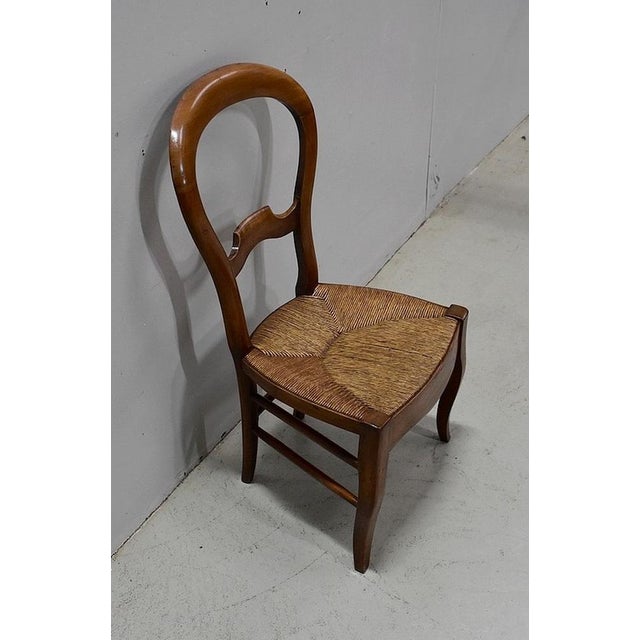 Small cherry chair, Louis Philippe era, with a child's height and artisanal mulch in perfect condition. Its balloon file,...
