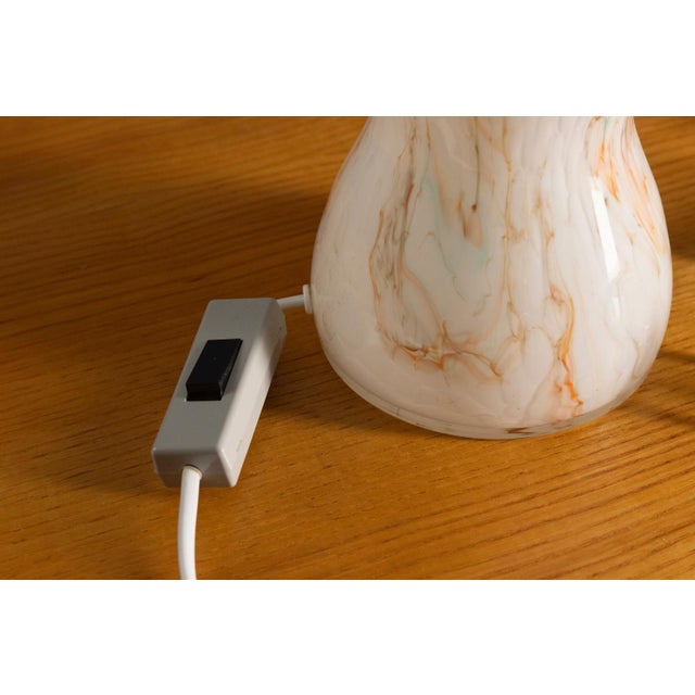 This pair of table lamps was produced in Czechoslovakia during the 1970s–1980s and reflects the decorative lighting design...