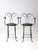This pair of antique wire bar stools by A.H. Andrews & Co. of Chicago dates to circa 1900–1915. The dark steel wire frames...