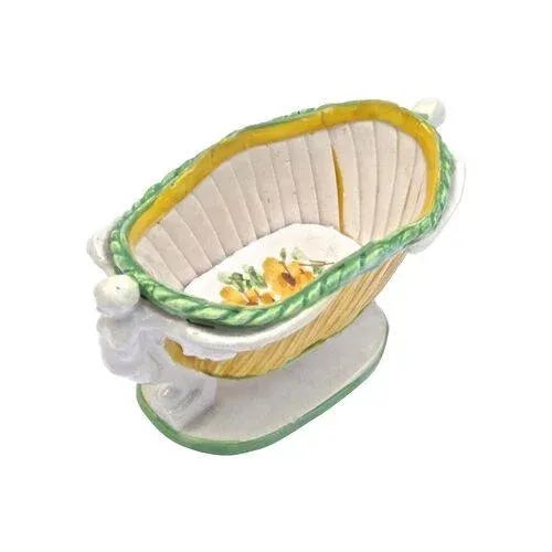 Antique Italian ceramic winged and floral caryatid basket cachepot. Winged carotid on each end with a hand-painted floral...