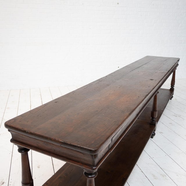Large oak draper's table, early 20th century Two drawers. Oak base and top. Lower shelf: fir and oak.