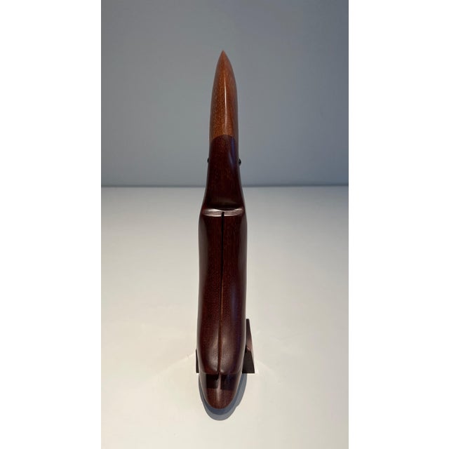 This sculpture representing a toucan is made of exotic wood with glass eyes. This is probably a French work. Circa 1970