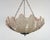 A vintage art deco pendant shade of chromed metal with three moulded clamshell slip shades, made of clear frosted glass...