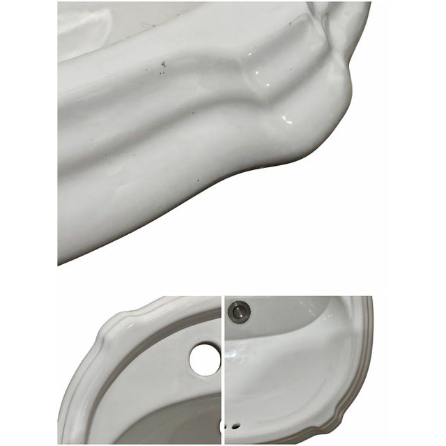 Bring timeless French elegance to your bathroom with this beautifully crafted white ceramic basin. Featuring a graceful,...