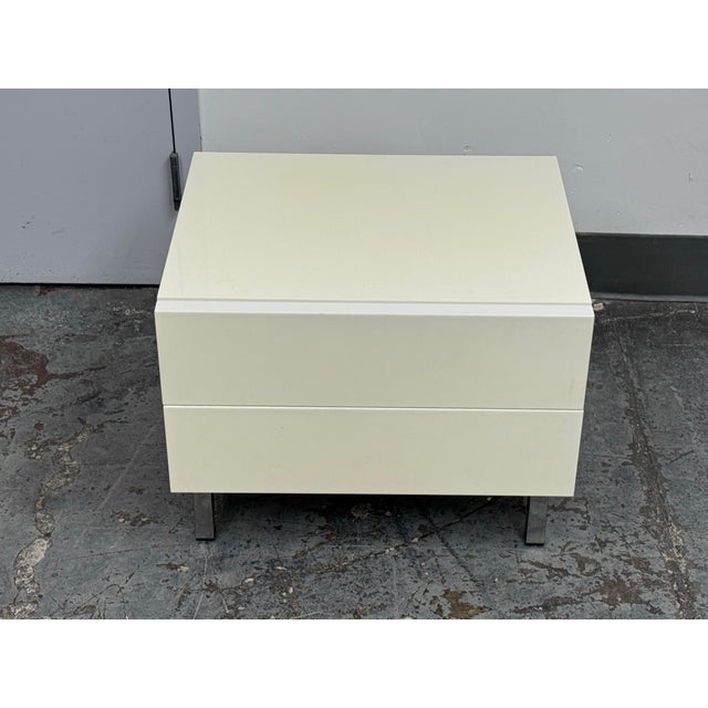Design Plus Gallery presents a Lacquered Two-Drawer Nightstand from Calligaris. The compact rectilinear cabinet has an...