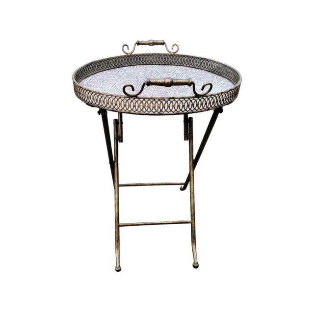 Copper and iron folding tray table with brass gallery Measures 20"D x 27"H and 32H when folded. Good vintage condition.