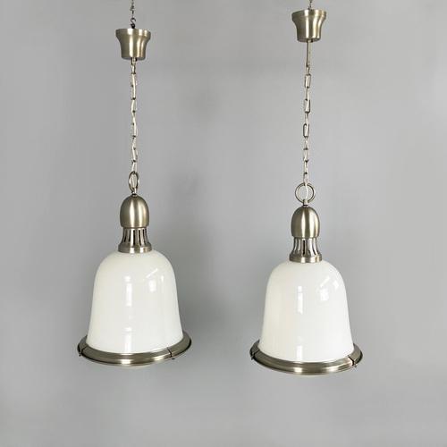 Italian mid-century modern Chandeliers in opaline glass and metal, 1960s Pair of round base chandeliers in metal and...
