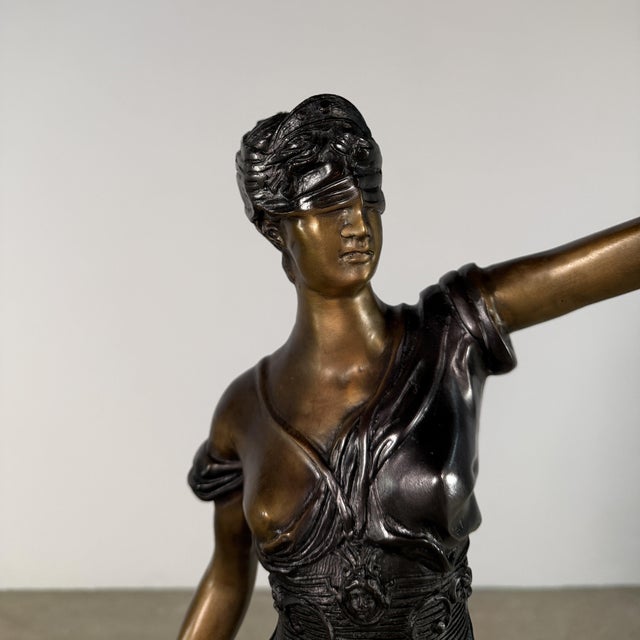 Bronze sculpture of Lady Justice (Justitia)—the enduring symbol of law, balance, and moral authority. Rooted in ancient...