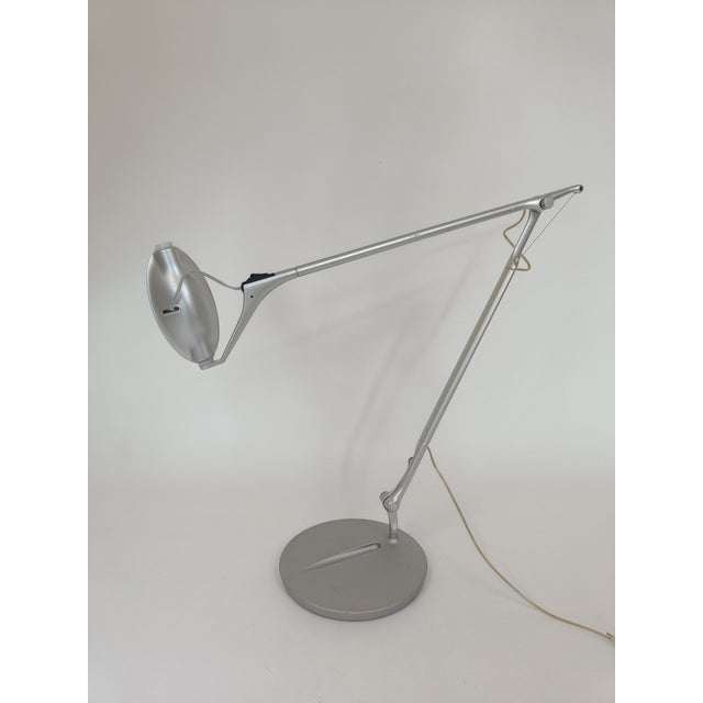 Italian desk lamp designed by Markus Jehs & Jürgen Laub for Nemo. The lamp is made of brushed aluminum and can be adjusted...