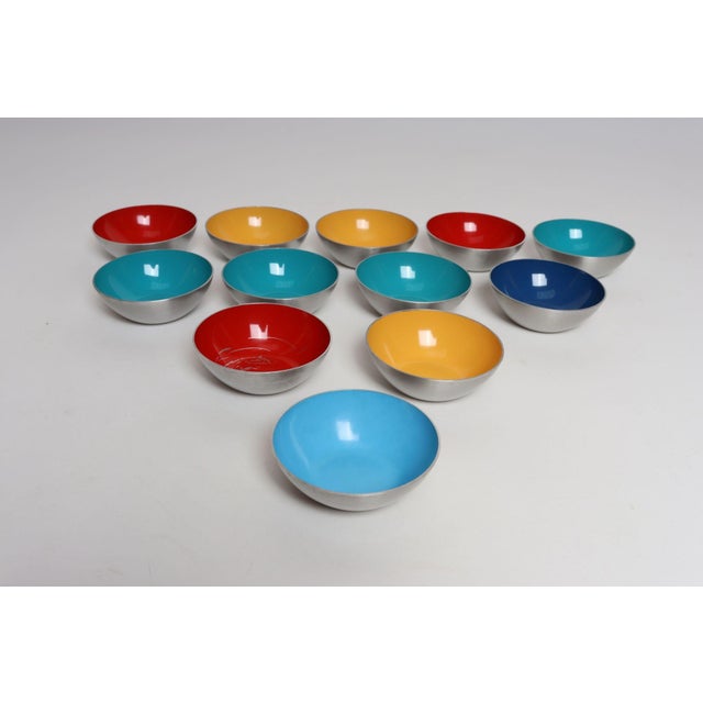 Set of twelve Danish Modern hors d'oeuvres/snack bowls in mustard, teal, sky blue, navy, and red enamel over brushed...