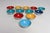Set of twelve Danish Modern hors d'oeuvres/snack bowls in mustard, teal, sky blue, navy, and red enamel over brushed...