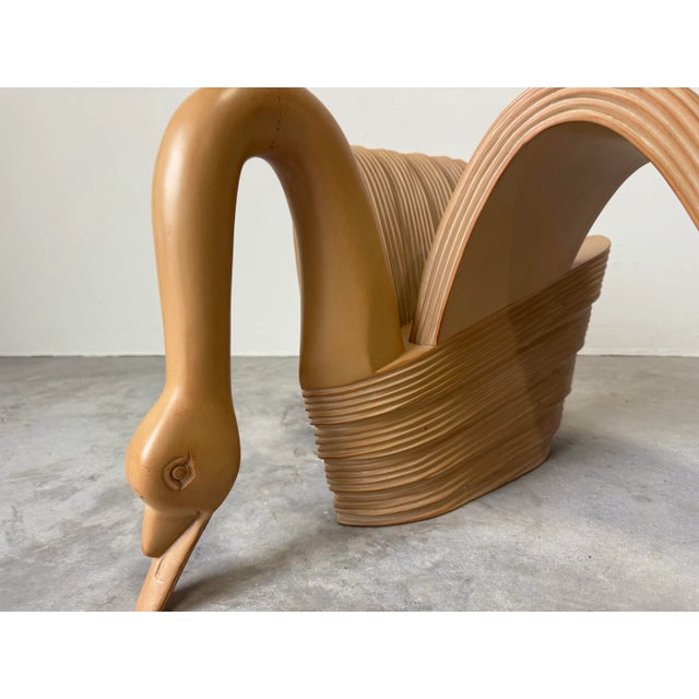 Bring a touch of coastal charm and whimsical elegance into your space with this vintage carved wood swan coffee table. The...