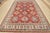 This traditional tribal geometric Caucasian Kazak rug is hand-knotted with an all-wool pile on a cotton foundation. This...