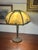 Beautiful Art Nouveau table Slag, glass lamp, and a beautiful sunset golden hue Victorian spider Web motif. This adds a...
