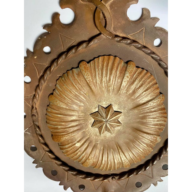 These are charming large Spanish Revival wall sconces that are a mix of metals: iron, nickel over brass that has worn thru...