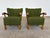A matched pair of oak lounge chairs in the Danish Modern tradition, upholstered in an original green patterned wool and...