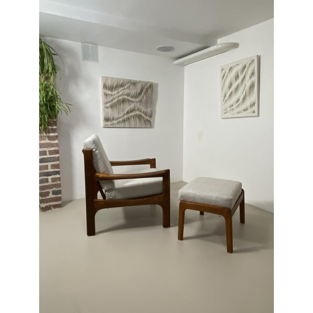 Danish Teak Armchair and Ottoman – 1960s An elegant Danish-made armchair and ottoman set dating from the 1960s. This...