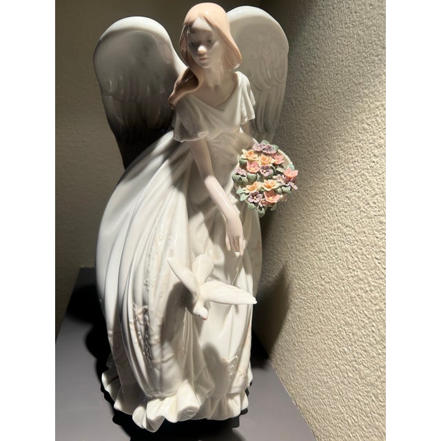 Elegant Lladro' "Flowers of Peace Limited Edition porcelain figurine (Model 01001867), sculpted by renowned Lladro' artist...