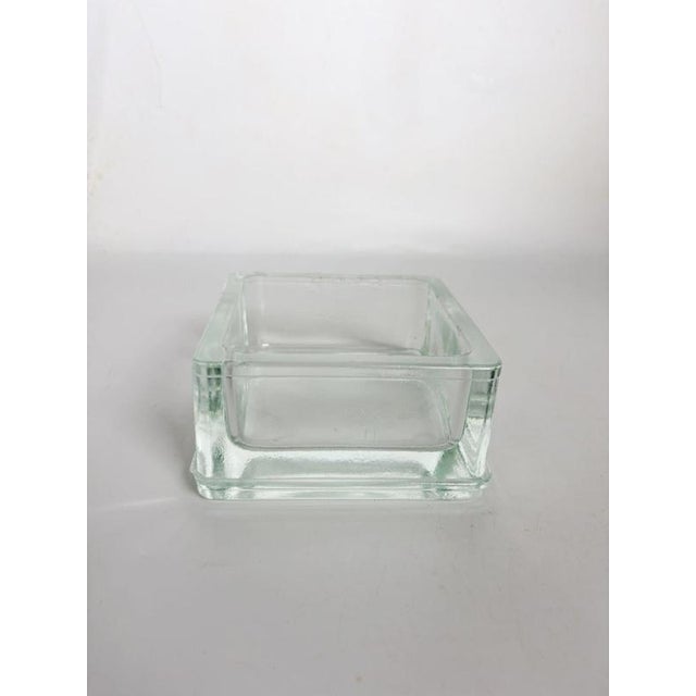 French Lumax molded glass ashtray associated with Le Corbusier. Made from thick transparent glass, the piece features a...