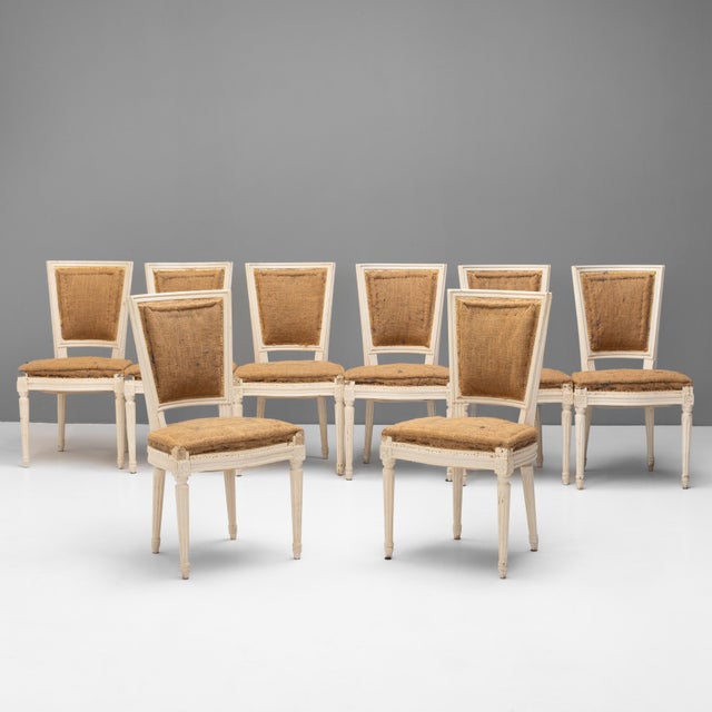 Set of 8 French dining chairs in original paint finish. Ready for a choice of upholstery. Circa 1930.