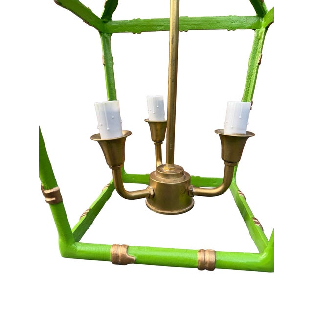 This vibrant green light fixture is the Dana Gibson Bamboo Lantern Chandelier, a notable piece in the Chinoiserie style....