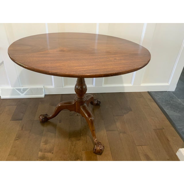 A large Chippendale Mahogany birdcage tilt top table with very nicely carved ball and claw feet. Appears to be an early...