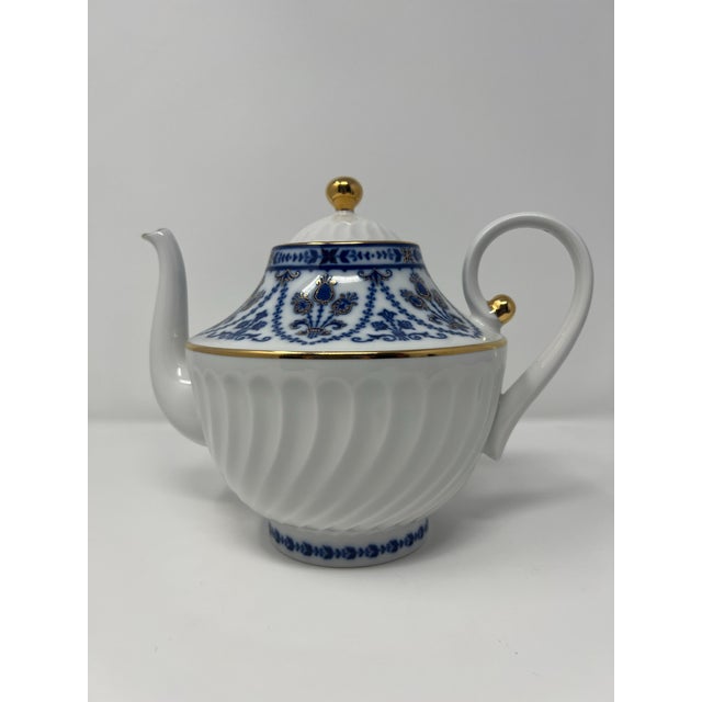 Refined hand-decorated Russian porcelain teapot by the Lomonosov Porcelain Factory of St. Petersburg, crafted in the...
