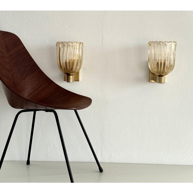 Set of two heavy wall sconces made of thick Murano glasses with much real gold shimmer/glitter inside the glass and strong...