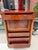 This is a French empire inspired tall writing desk. This desk has a single drawer at the top with three drawers below. The...
