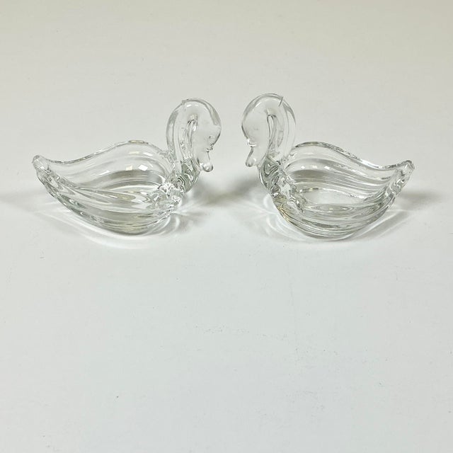 This is a gorgeous vintage set of Art Deco glass swan Salt Cellars and Butter Dish. The clear glass cellars are lovely in...