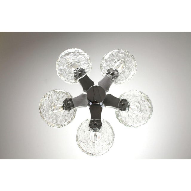 5-flame metal chandelier, 10 glass shades. This piece is attributed to the mentioned designer/maker. It has no attribution...