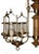 Mid 20th century wood and and brass six light chandelier featuring a turned wood central column with brass accents,...
