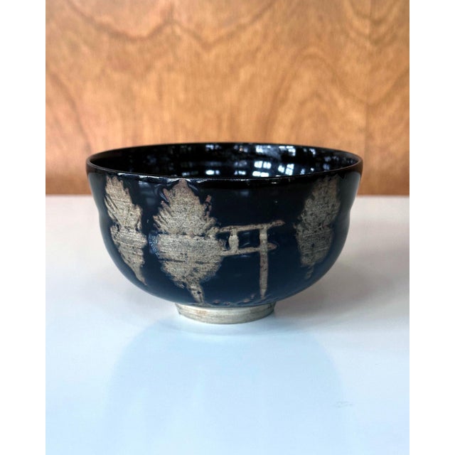 A Japanese chawan (tea bowl) of Kyo-yaki (Kyoto ware) attributed to Nin'ami Dōhachi, also known as Takahashi Dōhachi...