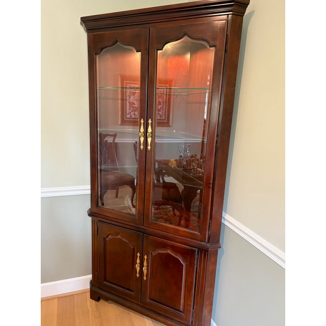 Stunning corner curio styled after the Thomasville Collector's Cherry collection. Measures 79 1/2" high x 20 1/2" deep x...