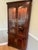 Stunning corner curio styled after the Thomasville Collector's Cherry collection. Measures 79 1/2" high x 20 1/2" deep x...